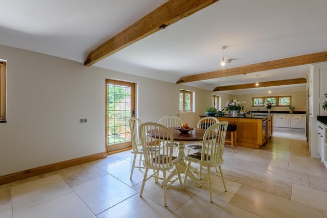 The dining area has space for a large table and doors from two aspects to the garden.