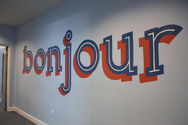 'Bonjour', a welcome message in French painted by learning support assistant Jessie Moon