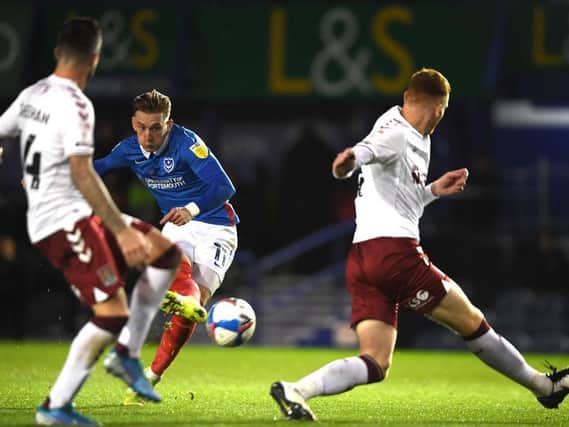 Ronan Curtis bends in Pompey's third goal. Pictures: Getty.