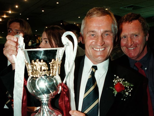 Denis Casey shows off the play-off trophy following the Cobblers' dramatic 1-0 win over Swansea City in 1997