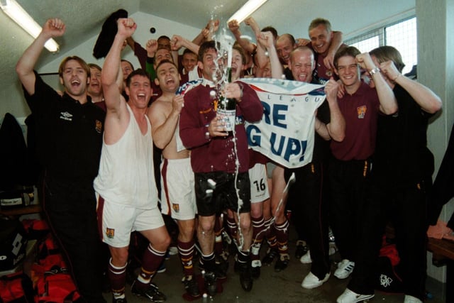 Denis Casey joins in the team celebrations after the Cobblers won promotion with the win at Torquay in May, 2000