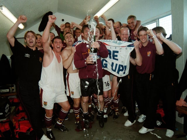 Denis Casey joins in the team celebrations after the Cobblers won promotion with the win at Torquay in May, 2000