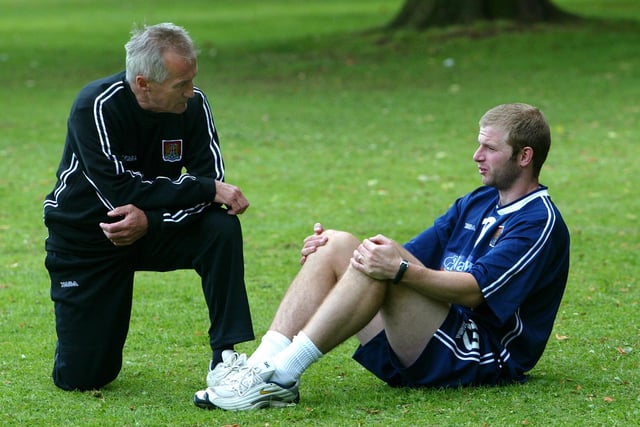 Denis Casey chats to Martin Smith during a pre-season session at Abington Park