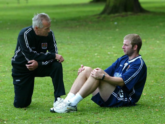 Denis Casey chats to Martin Smith during a pre-season session at Abington Park