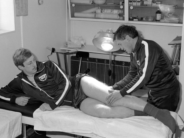 Denis Casey treats Graham Reed in the physio room at the Cobblers old club offices on Abington Avenue