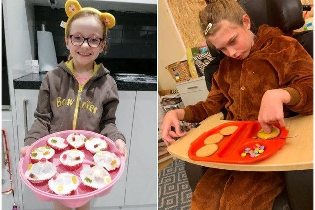 Bella Chapman from Hastings, left, baked cupcakes and Imogen from Lancing made Pudsey biscuits