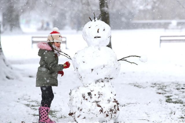 Hard at work on her snowman. Photo: Getty Images