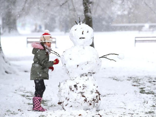 Hard at work on her snowman. Photo: Getty Images
