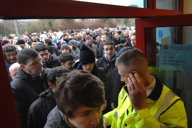 Fans enter the ticket office