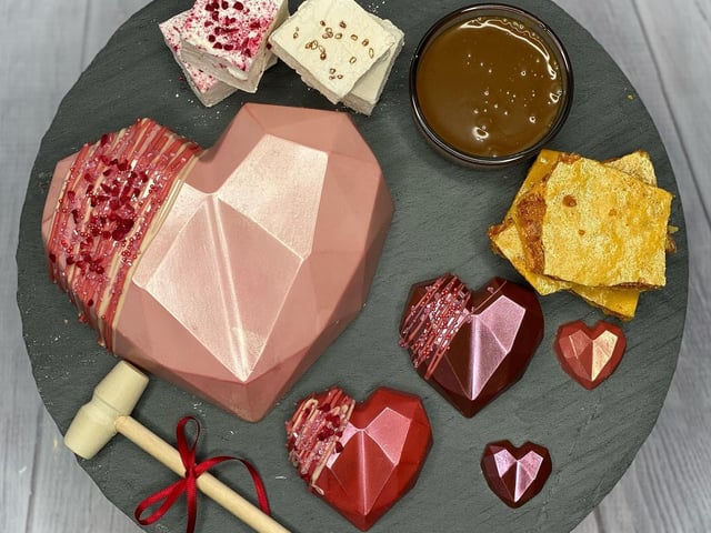 'Dilicious Wedding cakes' are offering a selection of £35 Valentine's Treatboxes, which include a large Belgian chocolate heart that can be smashed to reveal homemade brownie bites in triple chocolate and salted caramel flavours. It also includes chocolate hearts, marshmallow, honeycomb and toffee or chocolate sauce.