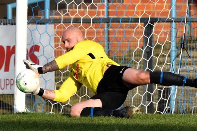 Stand-in keeper Jake Woodward saves a penalty