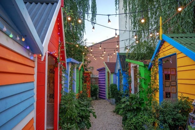The beach huts at the back of Red Hot Mama's Pizza in Regent Street.