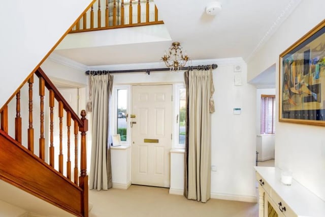 The property features a spacious hallway and galleried landing