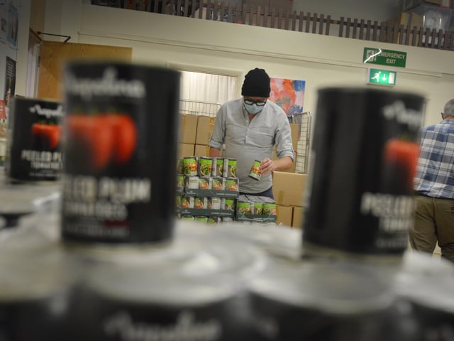 Surviving Christmas volunteers making hampers at the Salvation Army hall in Hastings. SUS-211214-121203001