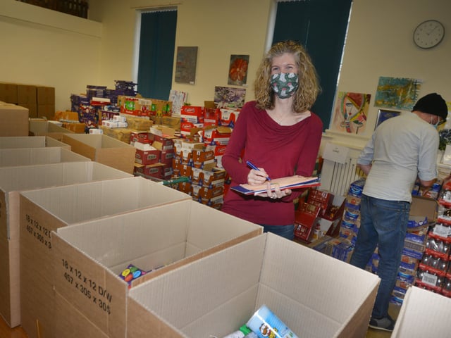 Surviving Christmas volunteers making hampers at the Salvation Army hall in Hastings. SUS-211214-121033001