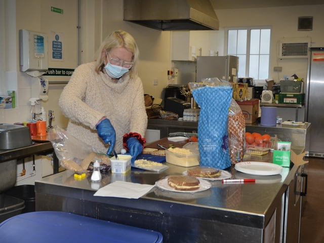 Surviving Christmas volunteers making hampers at the Salvation Army hall in Hastings. SUS-211214-121112001