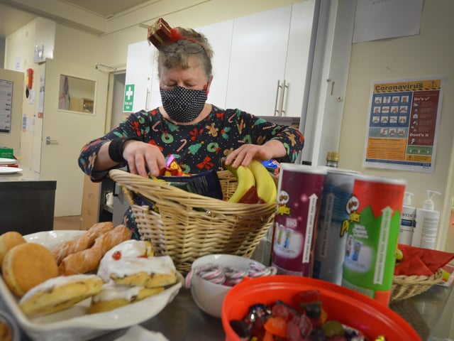 Surviving Christmas volunteers making hampers at the Salvation Army hall in Hastings. SUS-211214-121216001