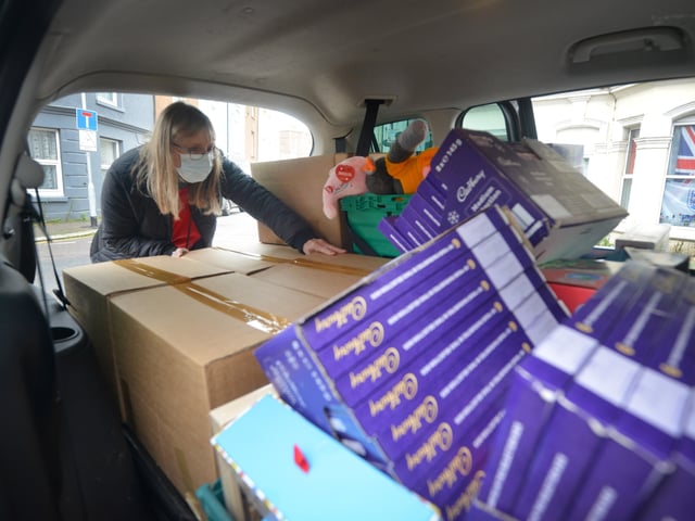Surviving Christmas volunteers making hampers at the Salvation Army hall in Hastings. SUS-211214-121428001