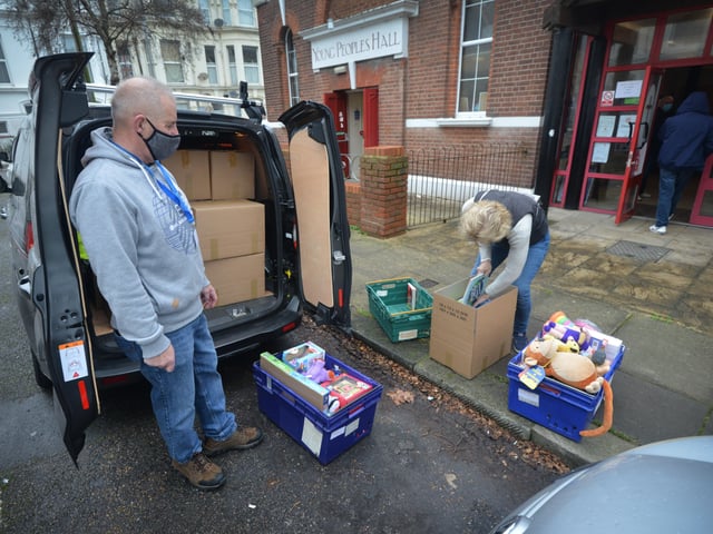 Surviving Christmas volunteers making hampers at the Salvation Army hall in Hastings. SUS-211214-121441001