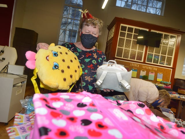 Surviving Christmas volunteers making hampers at the Salvation Army hall in Hastings. SUS-211214-121454001