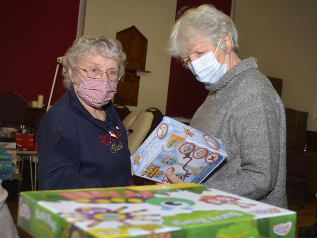 Surviving Christmas volunteers making hampers at the Salvation Army hall in Hastings. SUS-211214-121520001