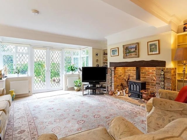 The double aspect sitting room gets lots of light from bay windows and French doors that lead out onto the patio. Picture: Hamptons - Haywards Heath Sales.