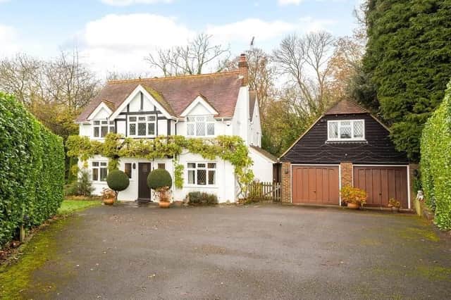 At the front the property has a sweeping driveway with established Wisteria and a double fronted facade. Picture: Hamptons - Haywards Heath Sales.