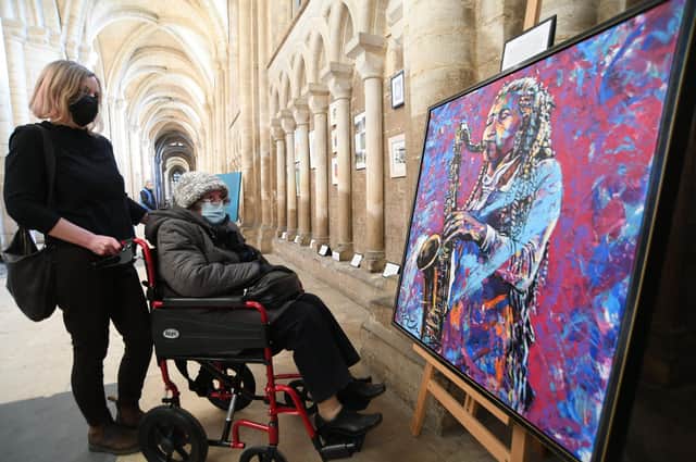 Made in Lockdown art exhibition at Peterborough Cathedral. Ingred Fortheath and Grita Matthews looking at some of the art EMN-220122-164808009