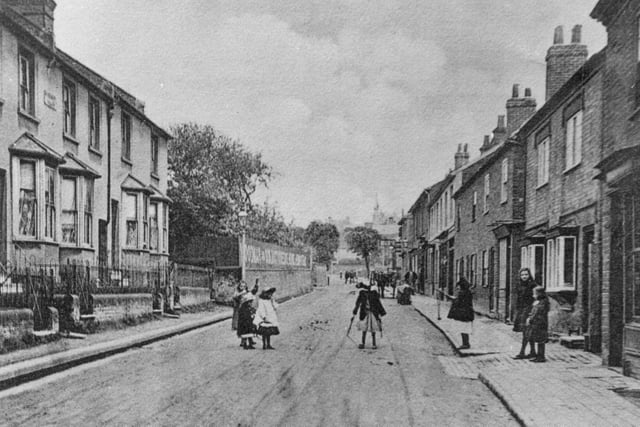 This lovely photo shows a very well known street. It's changed name since this photograph was taken - can you tell which it is?
