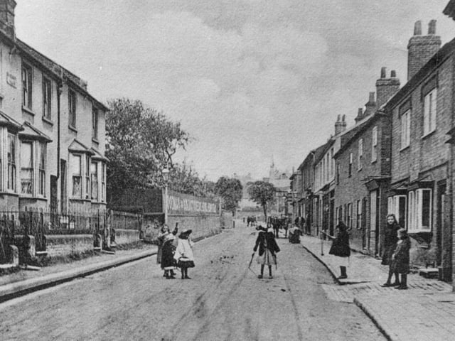This lovely photo shows a very well known street. It's changed name since this photograph was taken - can you tell which it is?