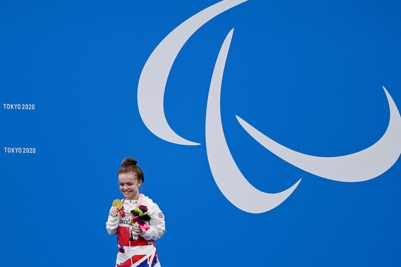 Maisie collects her medal at the Tokyo Paralympics