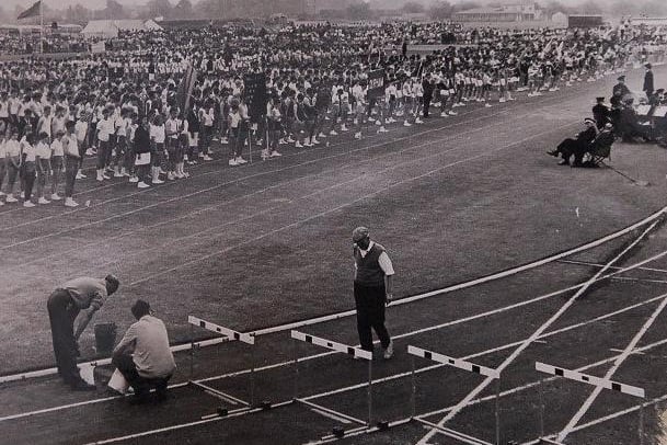 Orton Longueville School 50th anniversary exhibition and open day featured this image of the grand parade at an athletics meeting.