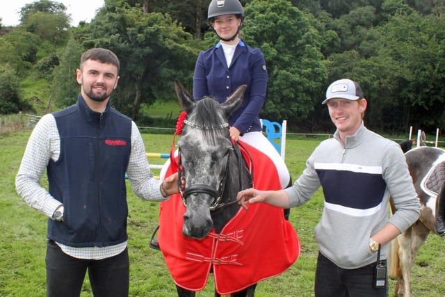 Winner in the pony class, Grace McNee, on her pony, Westway Summer, with David Oplhert and Daniel Coyle.