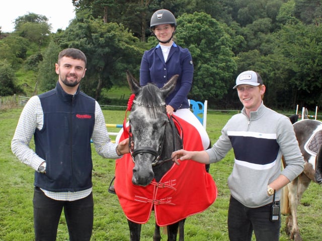 Winner in the pony class, Grace McNee, on her pony, Westway Summer, with David Oplhert and Daniel Coyle.