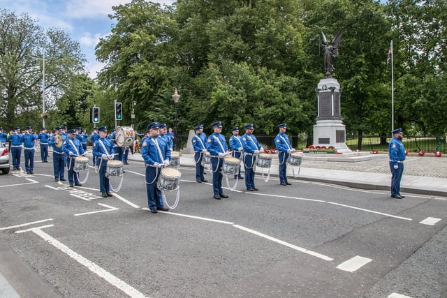 Lambeg Orange and Blue pause at Lisburn War Memorial on the Twelfth Day to pay their respects. Pic by Norman Briggs rnbphotographyni