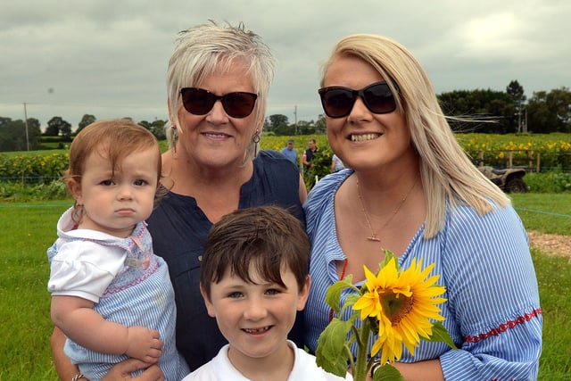 All smiles during their trip to the sunflower fields at Derryall Road last Thursday. INPT33-200.