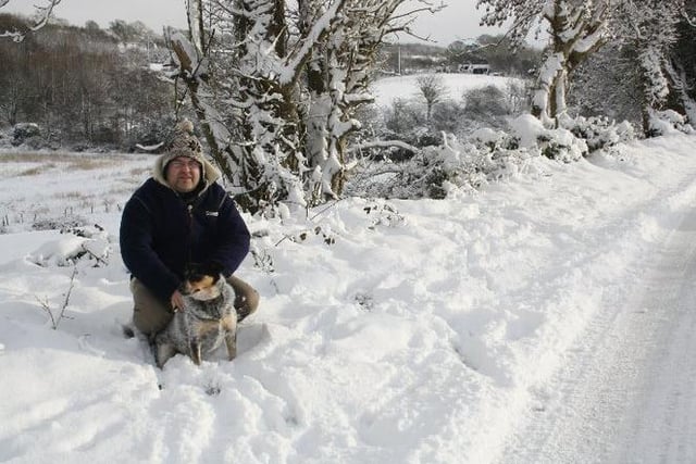News Letter journalist Darryl Armitage with his dog Scout at Duneight motte and bailey during the Big Freeze of 2010. Picture: Liz Armitage