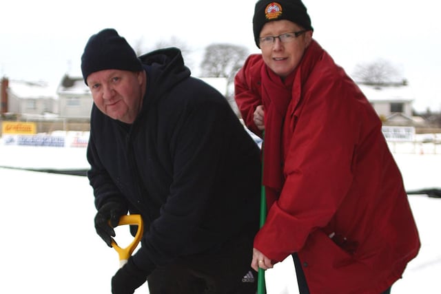 Terence Pentland and Kim Pentland digging in to lend a helping hand at Shamrock Park ahead of Portadown’s festive derby against Glenavon in December 2010. Picture: D Maginnis/Portadown FC/Portadown Times archives