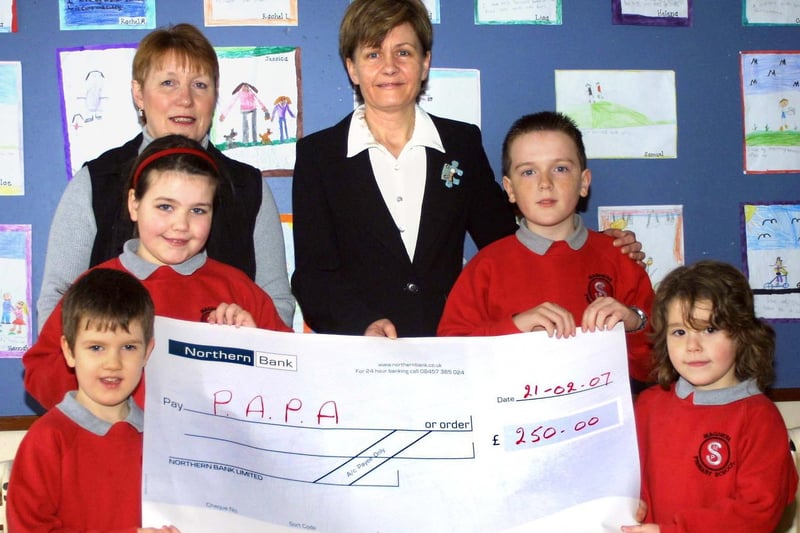 Maghera Primary School pupils Christopher, Lauren, John and Madison, present a cheque for £250 to Anne McIlvenna (Secretary of P.A.P.A Mid-Ulster). Included in the photograph is Mrs A Reid, Vice Principal of Maghera Primary School.mm1407-162ar.