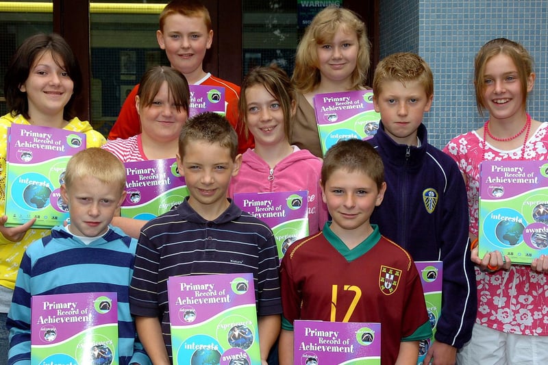 P7 pupils from Maghera Primary School pictured as they display their Primary School Record of Achievements.mm26-344sr