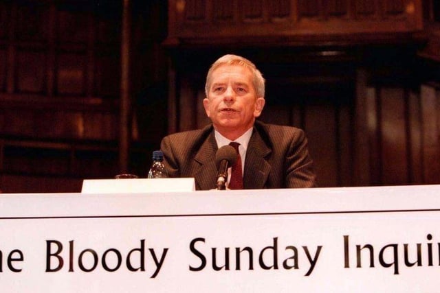 April 1998... Lord Saville, chairman of the new tribunal inquiring into the events of Bloody Sunday, makes his opening statement at the Guildhall.