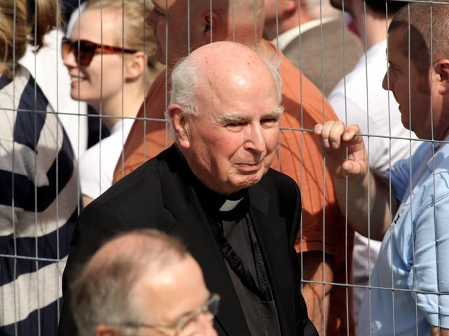 Bishop Edward Daly leaves the Guildhall after hearing the findings of the Saville Report.