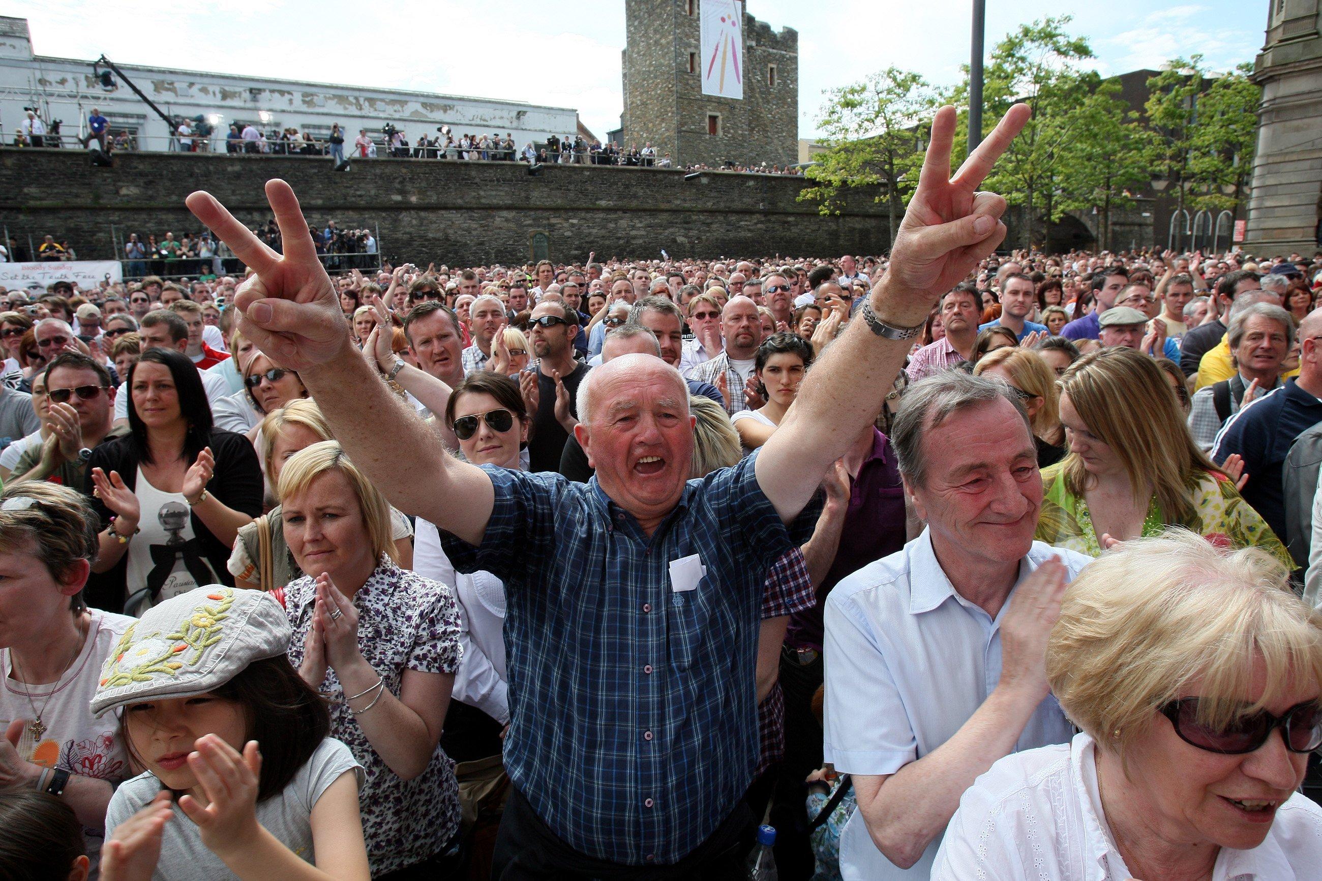 Crowds celebrate the findings of the long-awaited Saville Inquiry report into Bloody Sunday. Pictured centre is Hugh McMonagle who was among a group of men who cradled the body of the fatally wounded Jackie Duddy on January 30, 1972.