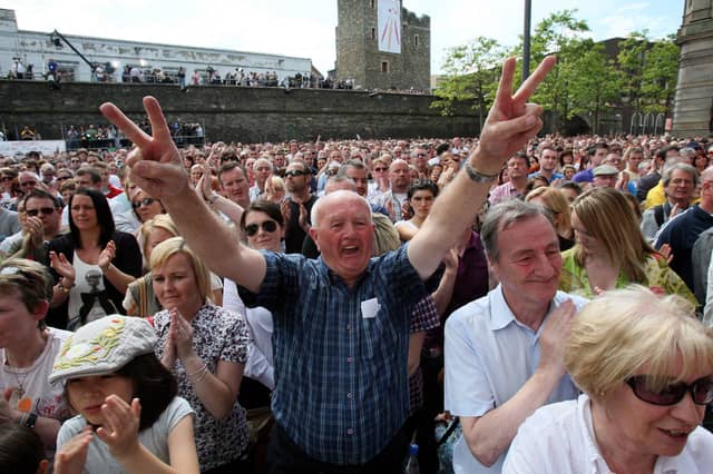 Crowds celebrate the findings of the long-awaited Saville Inquiry report into Bloody Sunday. Pictured centre is Hugh McMonagle who was among a group of men who cradled the body of the fatally wounded Jackie Duddy on January 30, 1972.