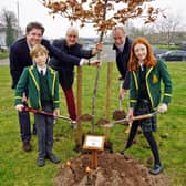 George and Jemima Linney planting a tree at the special ceremony.
Back, Charles Linney executive director, Patrick Chandler chief executive of Sherwood Forest Trust and Nick Linney, Chairman.