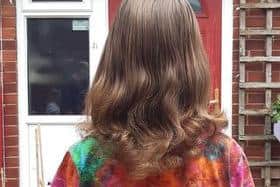 Eleven-year-old Alfie Bunker with his wavy long hair which he will cut off to raise money for the King Mill Hospital neo-natal intensive care unit.