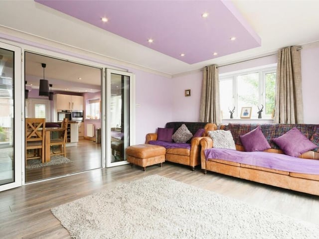 A second look at the lounge, which could be described as the beating heart of the £330,000 home. The doors lead into the open-plan kitchen diner.