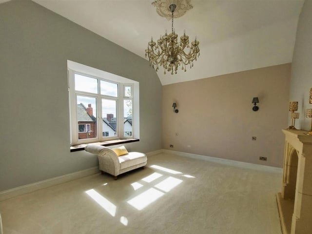 The main bedroom on the first floor of the house stands at more than 170 square feet or 16 square metres. It boasts a feature fireplace and even its own dressing area.