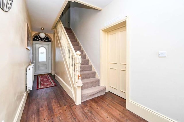 This is the entrance hallway, with the stairs leading to the first floor of the £370,000 Kirkby property. This hall also gives access to the cellar.