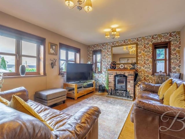 We begin our tour of the £330,000-plus Kirkby house in the largest room on the ground floor, this lavish living room. Its focal point is a feature fireplace, while double windows at both the front and side allow through a wealth of natural light.